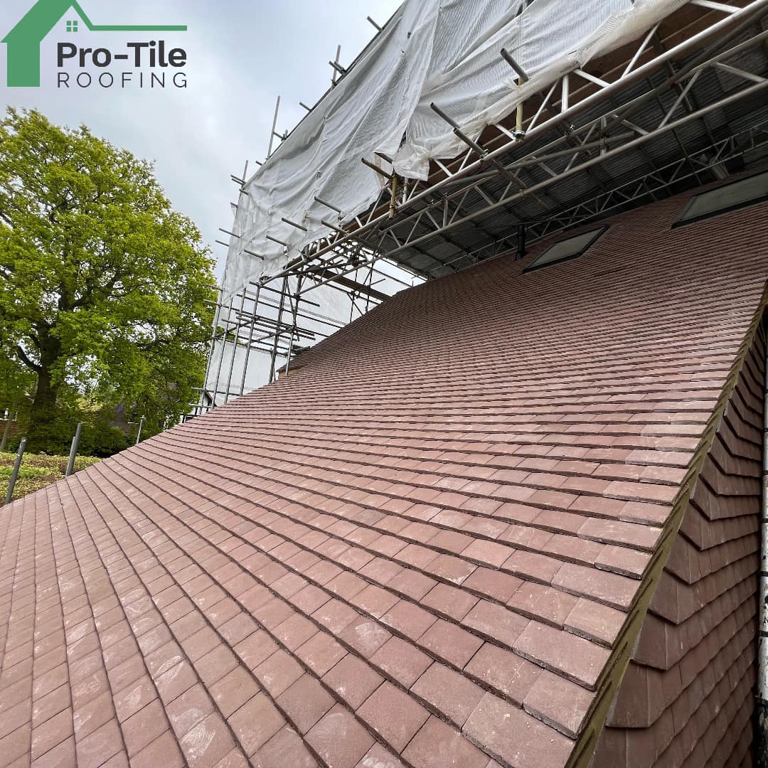 Finished plain tile roof in red clay