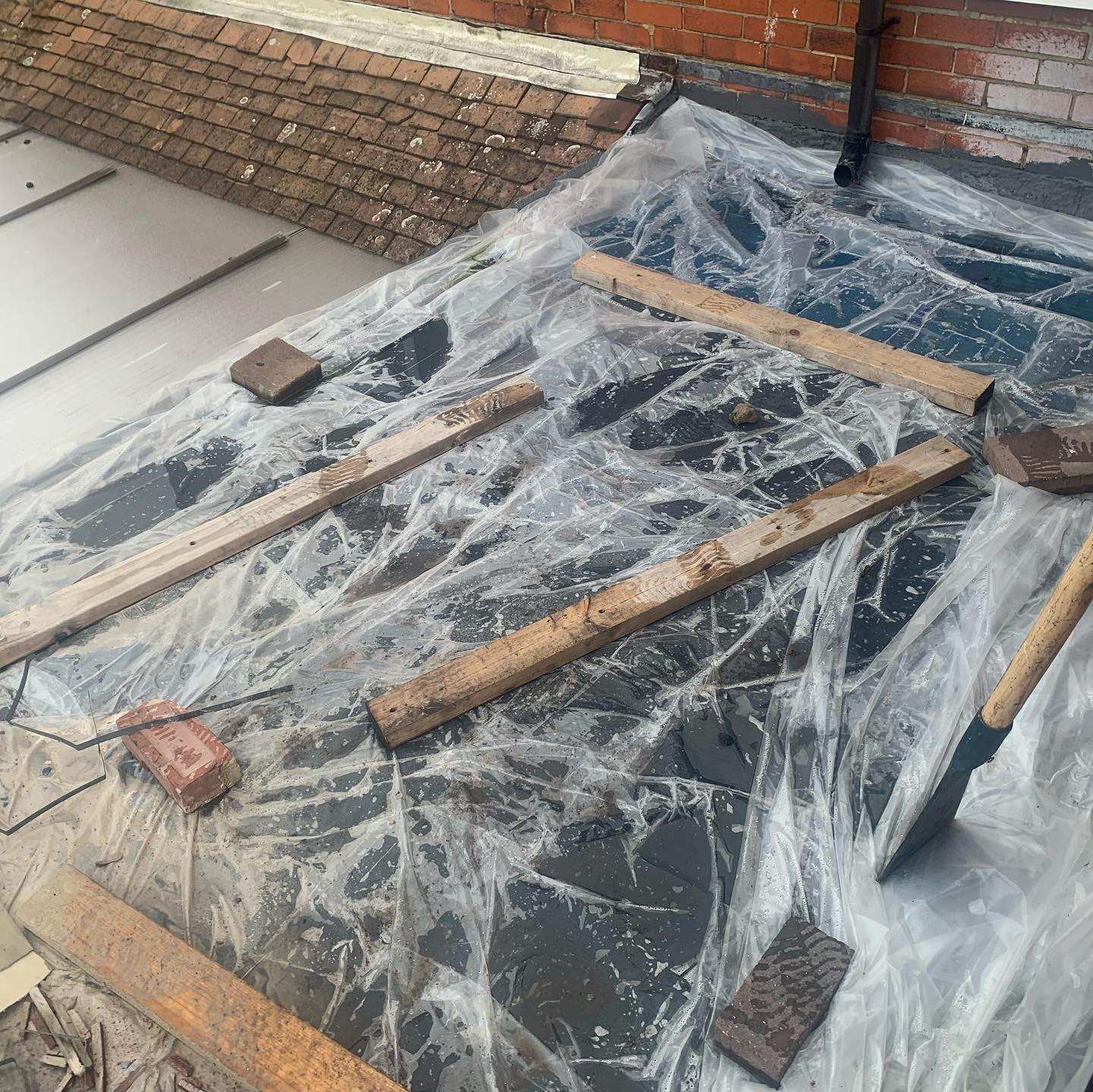 Torch-on felt flat roof underway