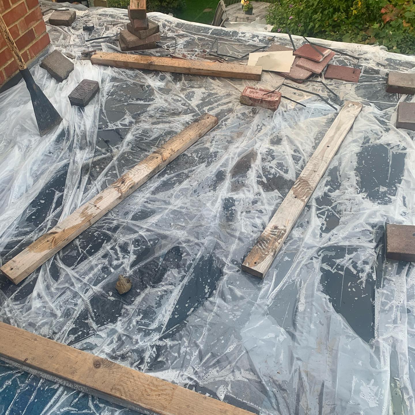 Flat roof felt close-up with weights